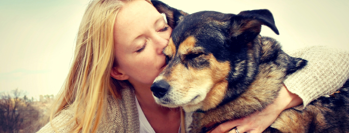 Woman hugging a dog